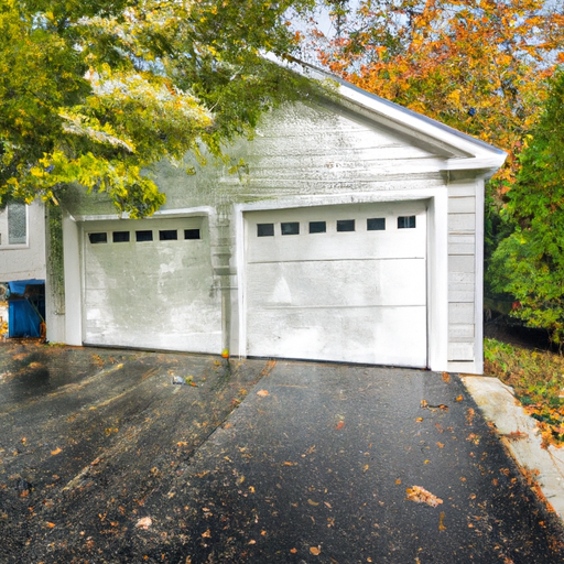 Suburban Chatham home with a closed insulated garage door and maple trees in early autumn.